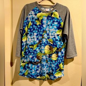 Cute LuLaRoe floral top with gray sleeves. Size L. Excellent condition.